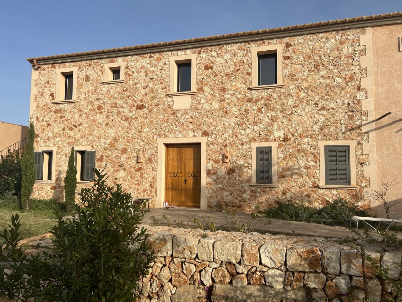 Outdoor pool area with mountain views at a luxury rental in southeast Mallorca