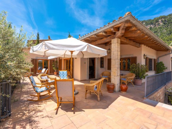 Rustic stone arch porch of finca in Mallorca call Anderson West to tour this home in Valldemossa today