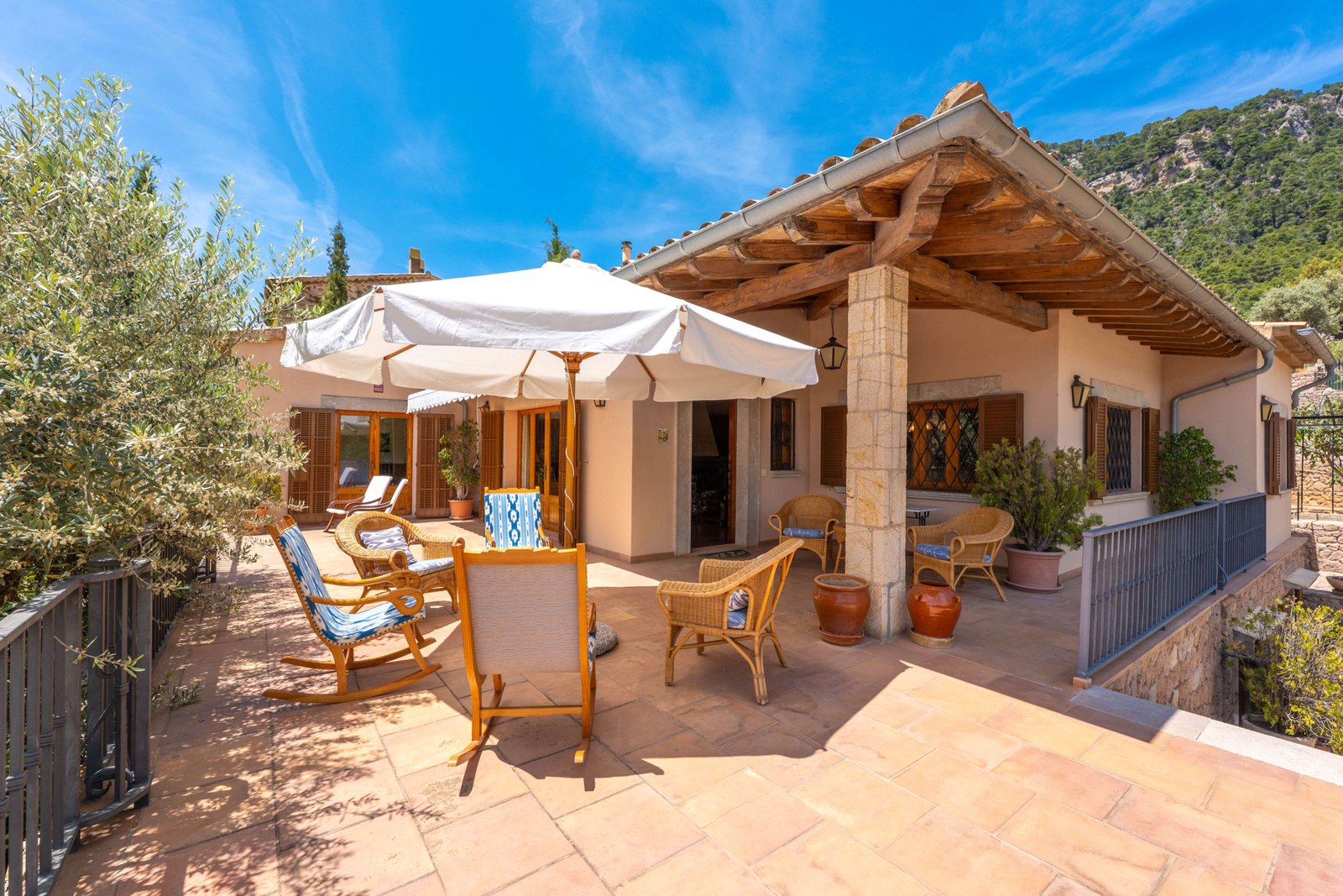 Rustic stone arch porch of finca in Mallorca call Anderson West to tour this home in Valldemossa today