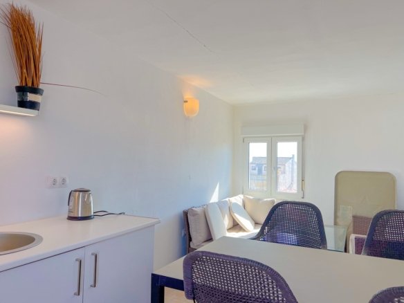 Bright hallway and staircase connecting multiple levels in Felanitx house for sale