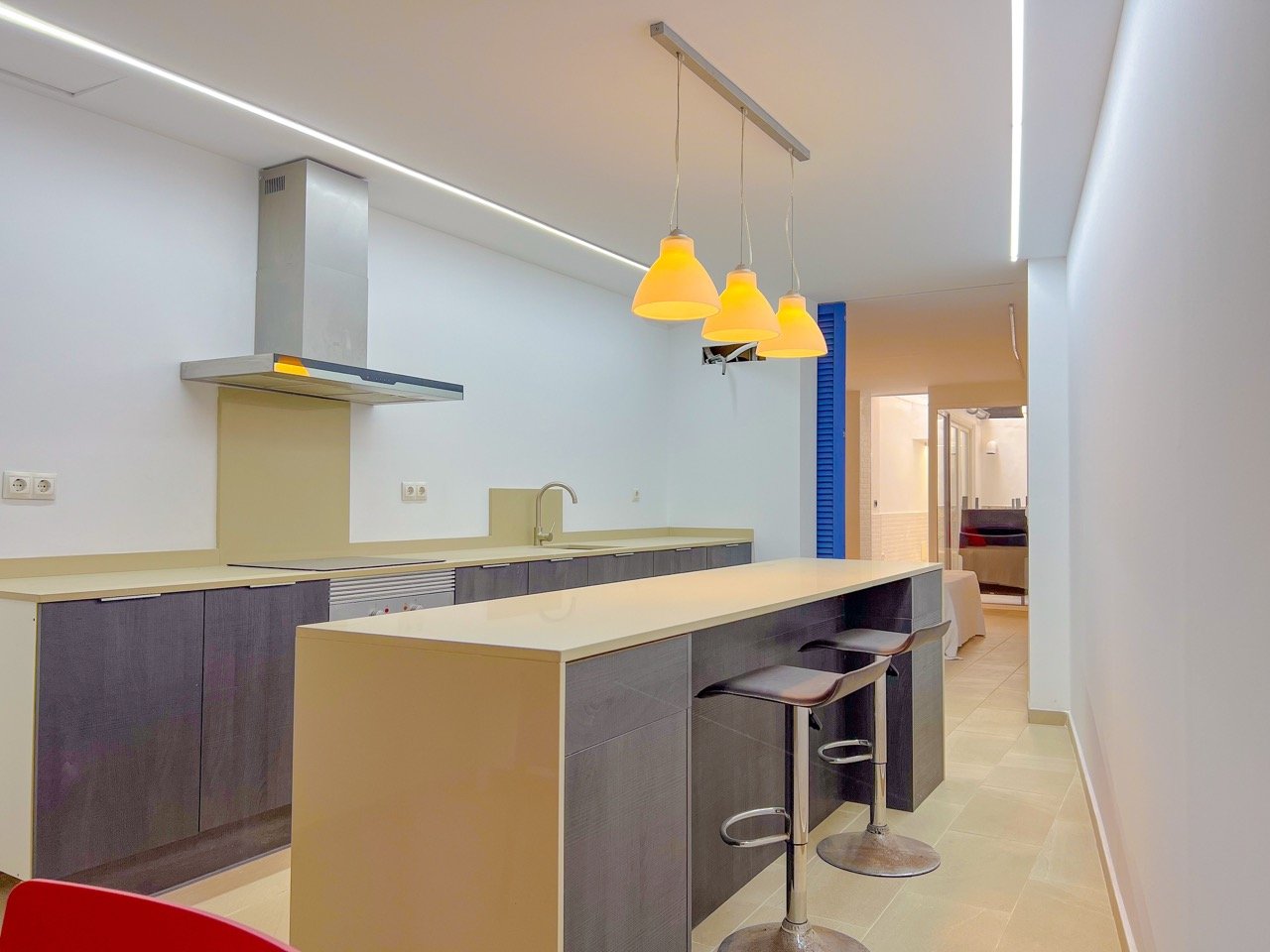 Open-plan living and dining area with natural light and direct access to a private terrace in Felanitx townhouse
